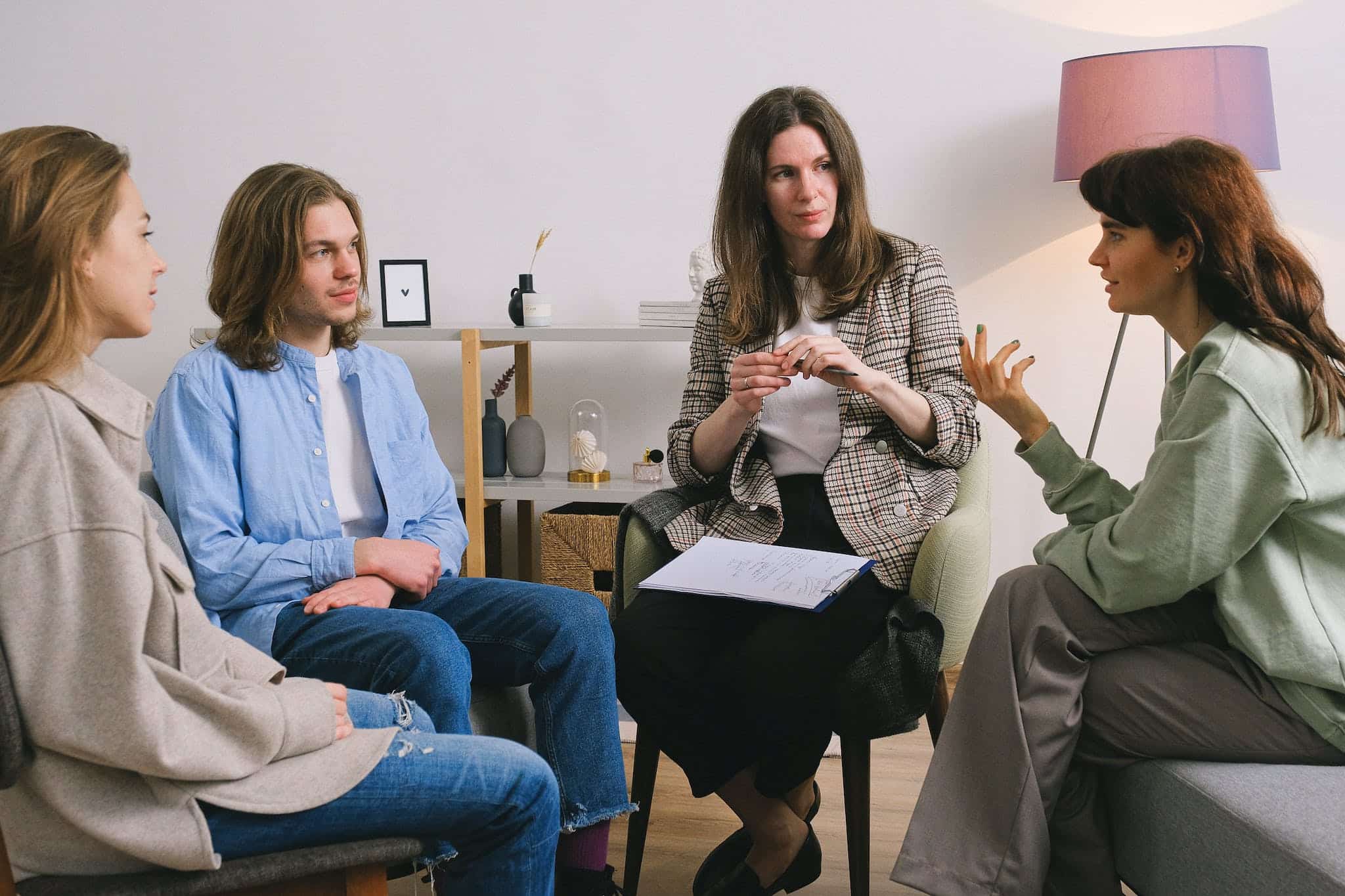 About 9 woman discussing problem during group therapy